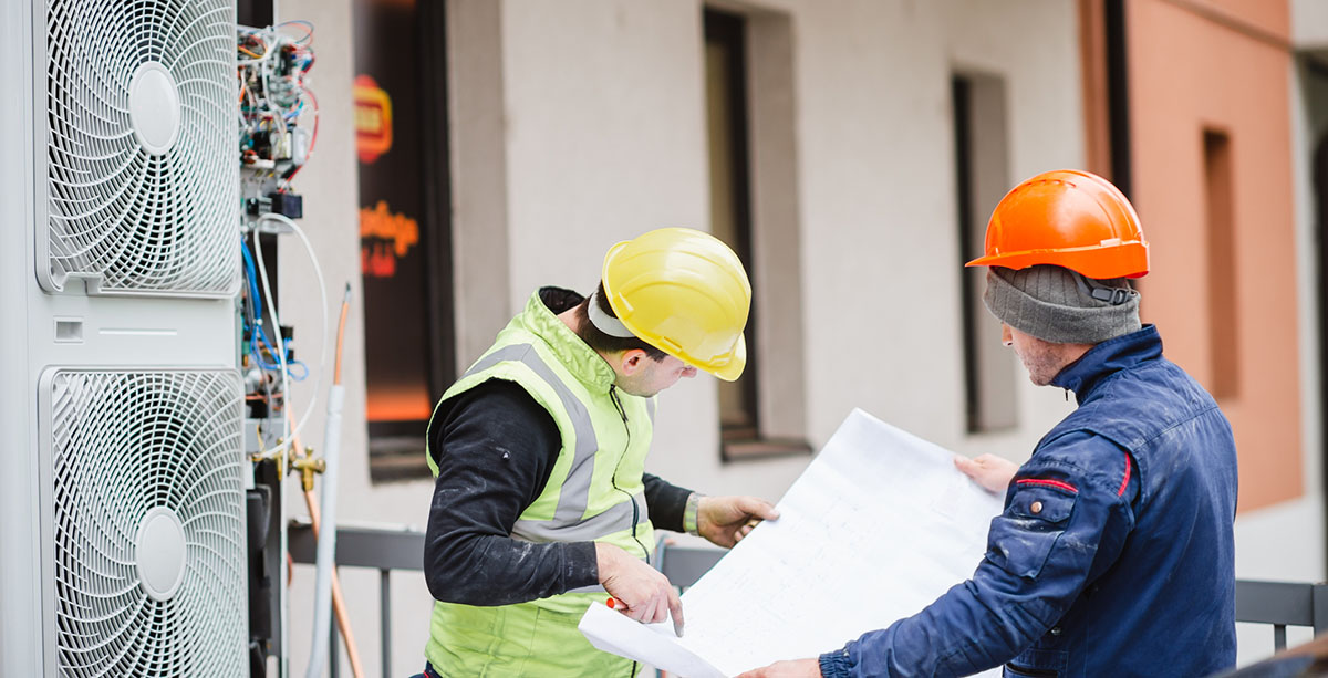 Workers with blueprint