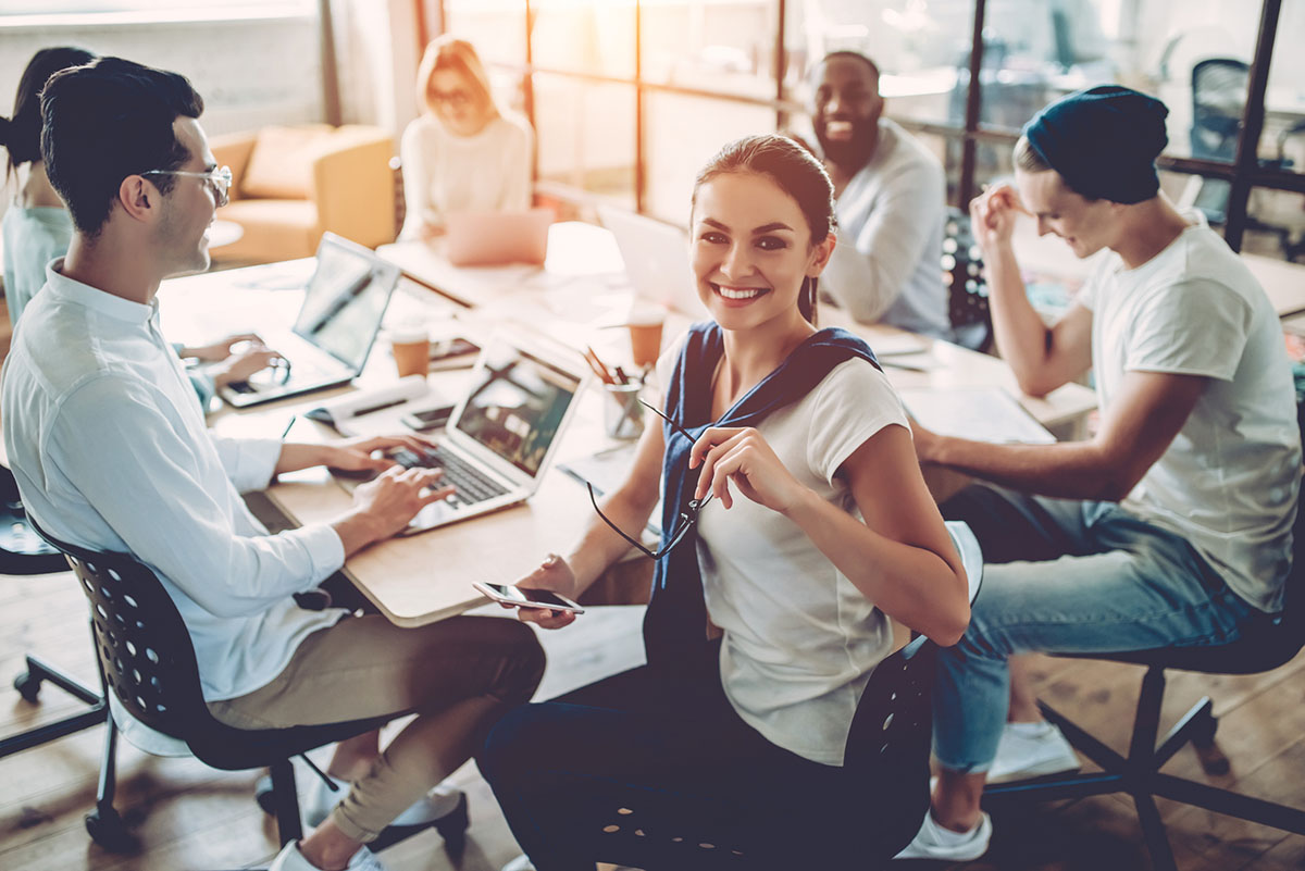 Young people work in modern office.